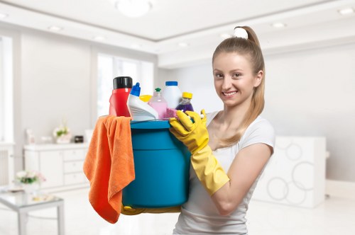 Inspecting stains and wear on a sofa before upholstery cleaning